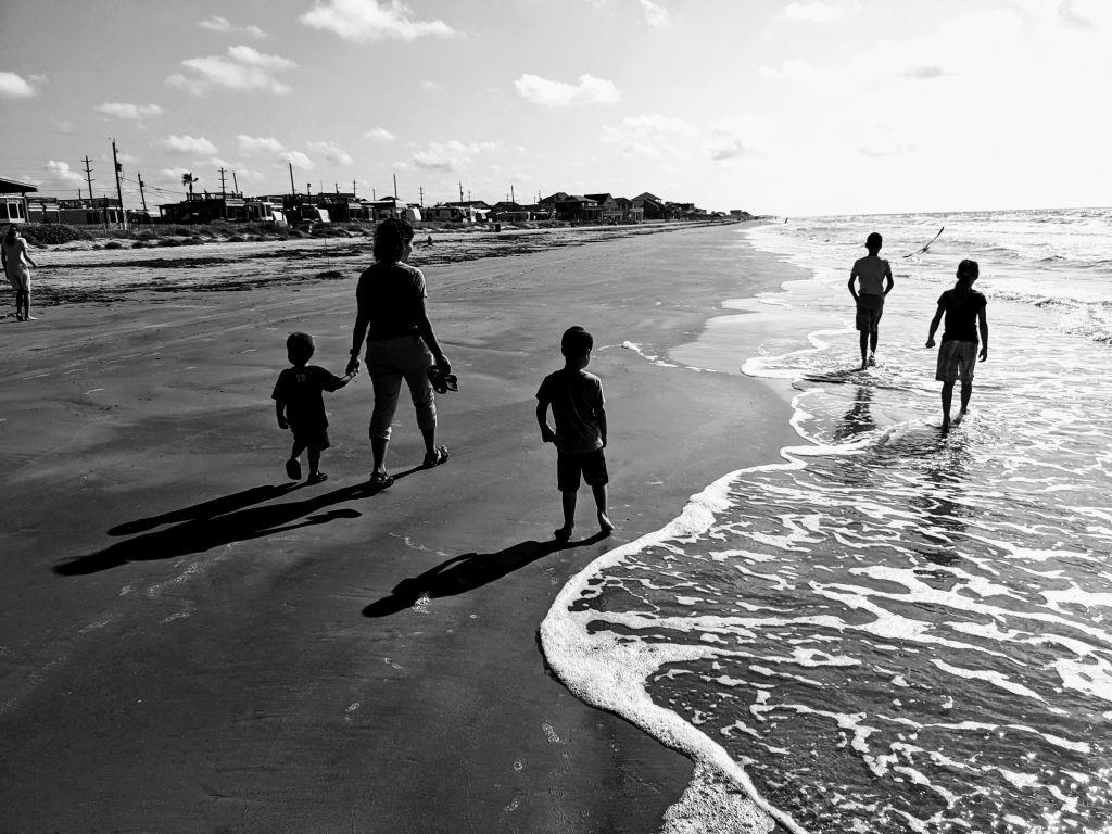 family together at Galveston Beach, Texas